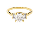 Load image into Gallery viewer, A gold engagement ring with a central moissanite diamond and two emerald cut accents