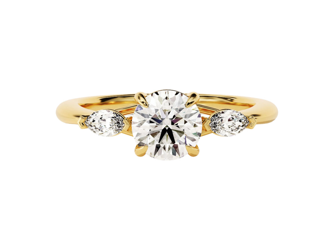 A round cut three stone moissanite engagement ring set in a 14k gold band