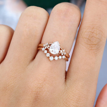 Pear Cut Moissanite Criss Cross Diamond Accented Bridal Ring Set