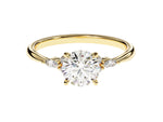 Load image into Gallery viewer, A gold-banded ring with a round cut moissanite center stone and smaller round accent stones on the band.