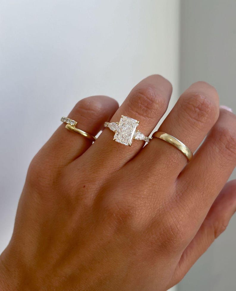 Detailed view of radiant 3.0tcw lab created diamond ring with a high cathedral setting, hidden halo glow, and pave-covered band. A breathtaking engagement or wedding ring for her, symbolizing timeless commitment with ethical, lab grown diamonds and exceptional craftsmanship.
