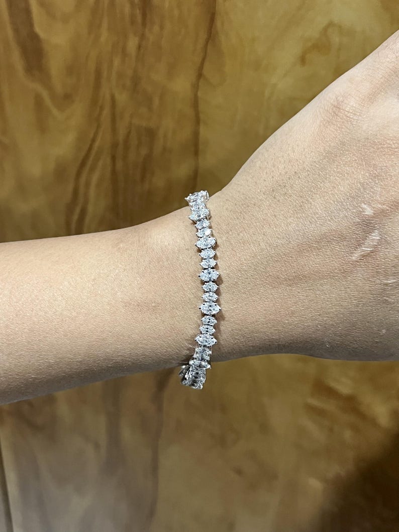 briar rose three stone with marquise center, trillion side stones