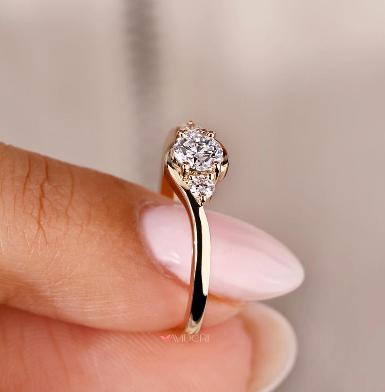 Yellow gold engagement ring featuring a round cut diamond for a classic look.