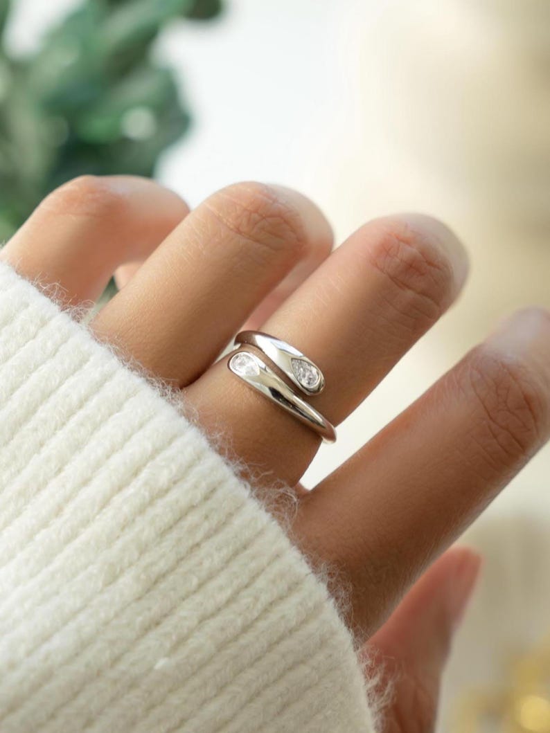 Sterling silver diamond ring on models hand