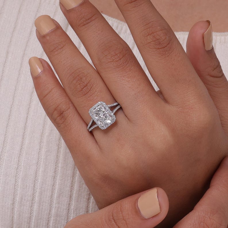 Lab grown radiant cut diamond solitaire engagement ring with split shank band in 10k gold.