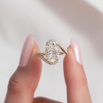 4CT oval cut moissanite engagement ring in 14k yellow gold twisted band.