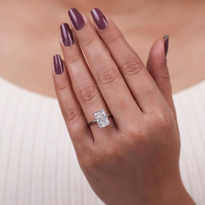 Radiant cut lab grown diamond solitaire engagement ring set in 4 claw prongs crafted in 18k solid gold.