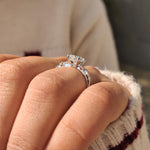 Load image into Gallery viewer, Radiant cut diamond ring featuring round diamond cluster setting.
