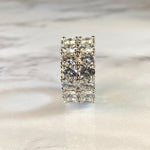 Load image into Gallery viewer, Diamond ring with a rectangular stone on a light background